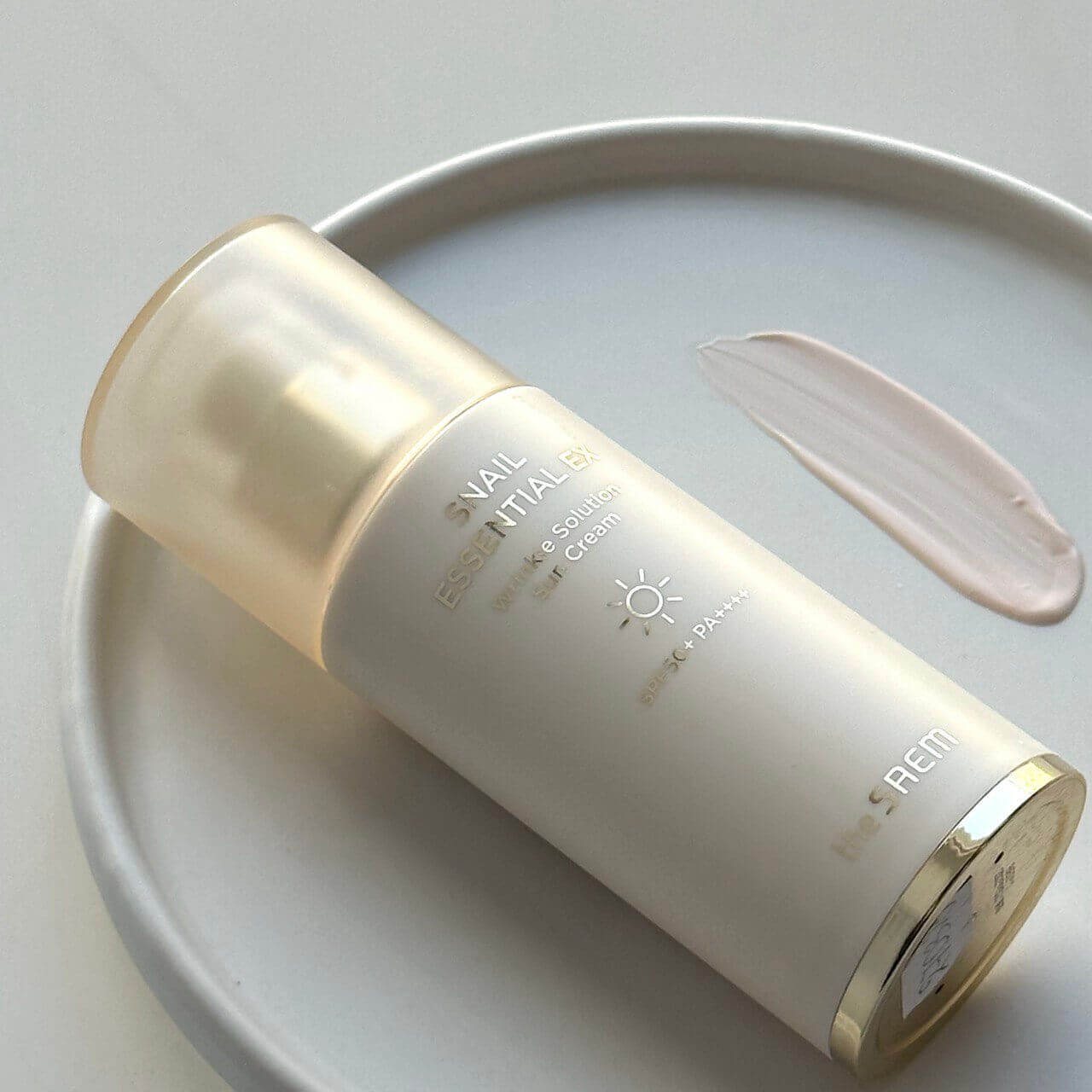 Санскрин с муцином улитки The Saem Snail Essential EX Wrinkle Solution Sun Cream SPF50+ PA++++