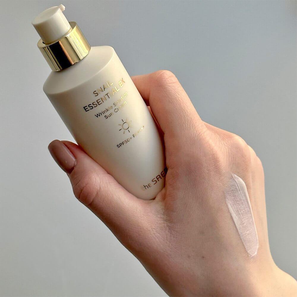 Санскрин с муцином улитки The Saem Snail Essential EX Wrinkle Solution Sun Cream SPF50+ PA++++